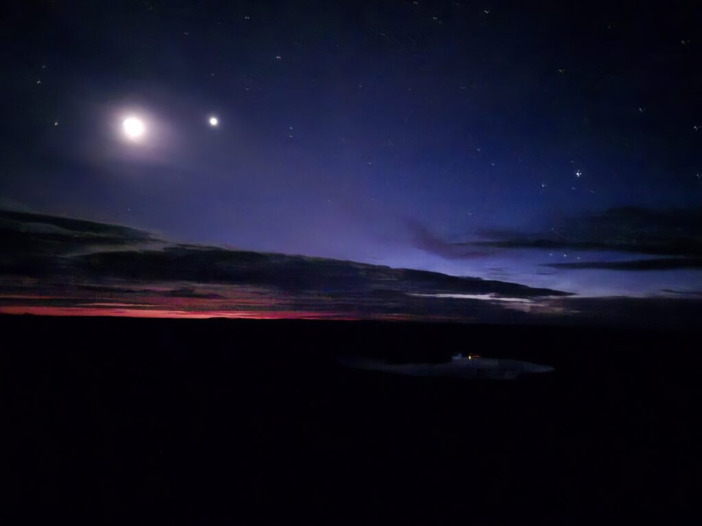 Moon and stars before dawn