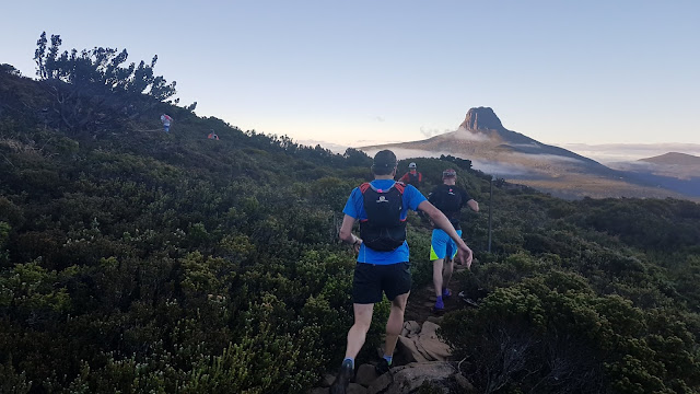 Trail runners with Barn Bluff and Mt Inglis